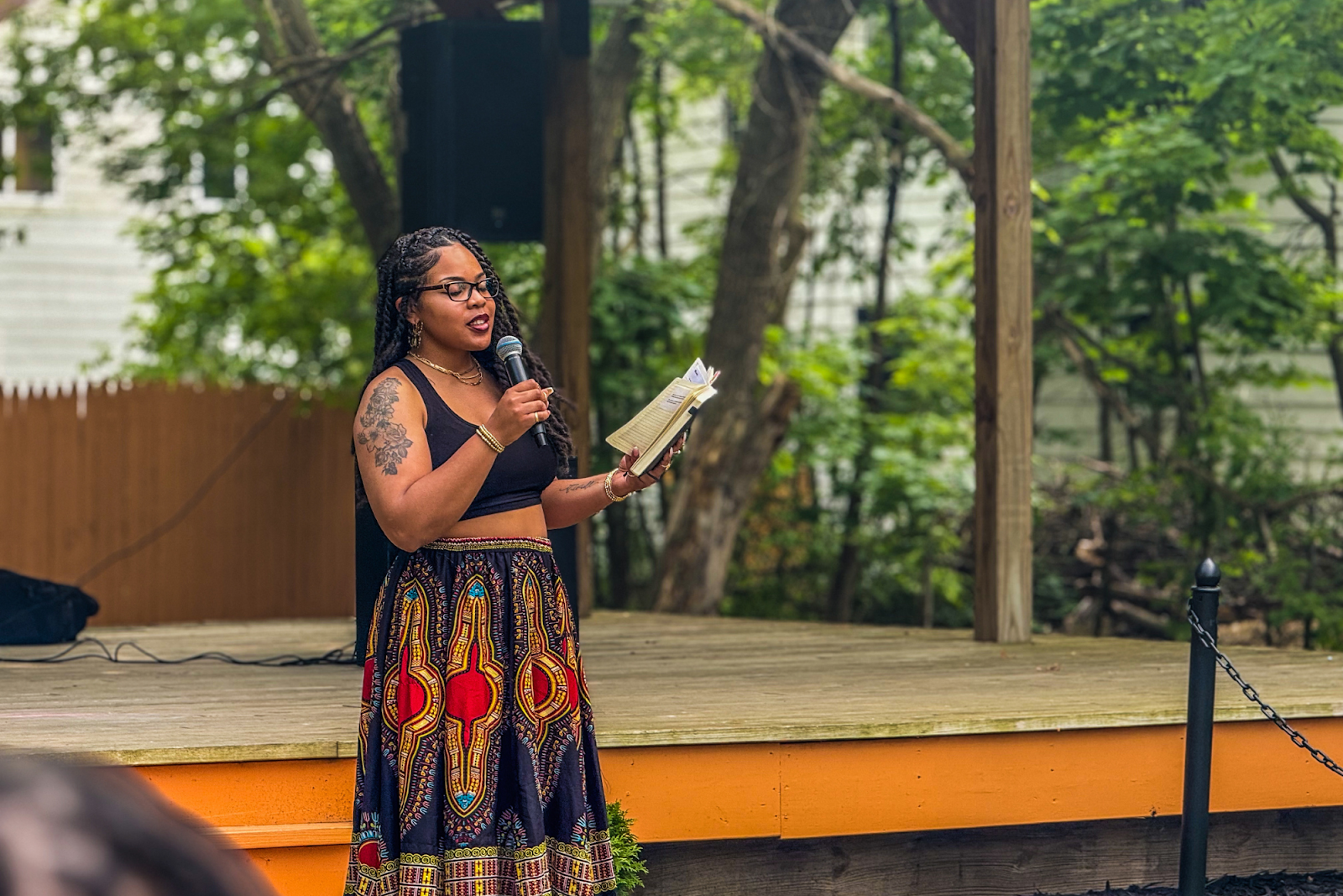 A local poet shares a piece on what it means to be a Black woman at URC's Juneteenth event on June 8, 2025.
