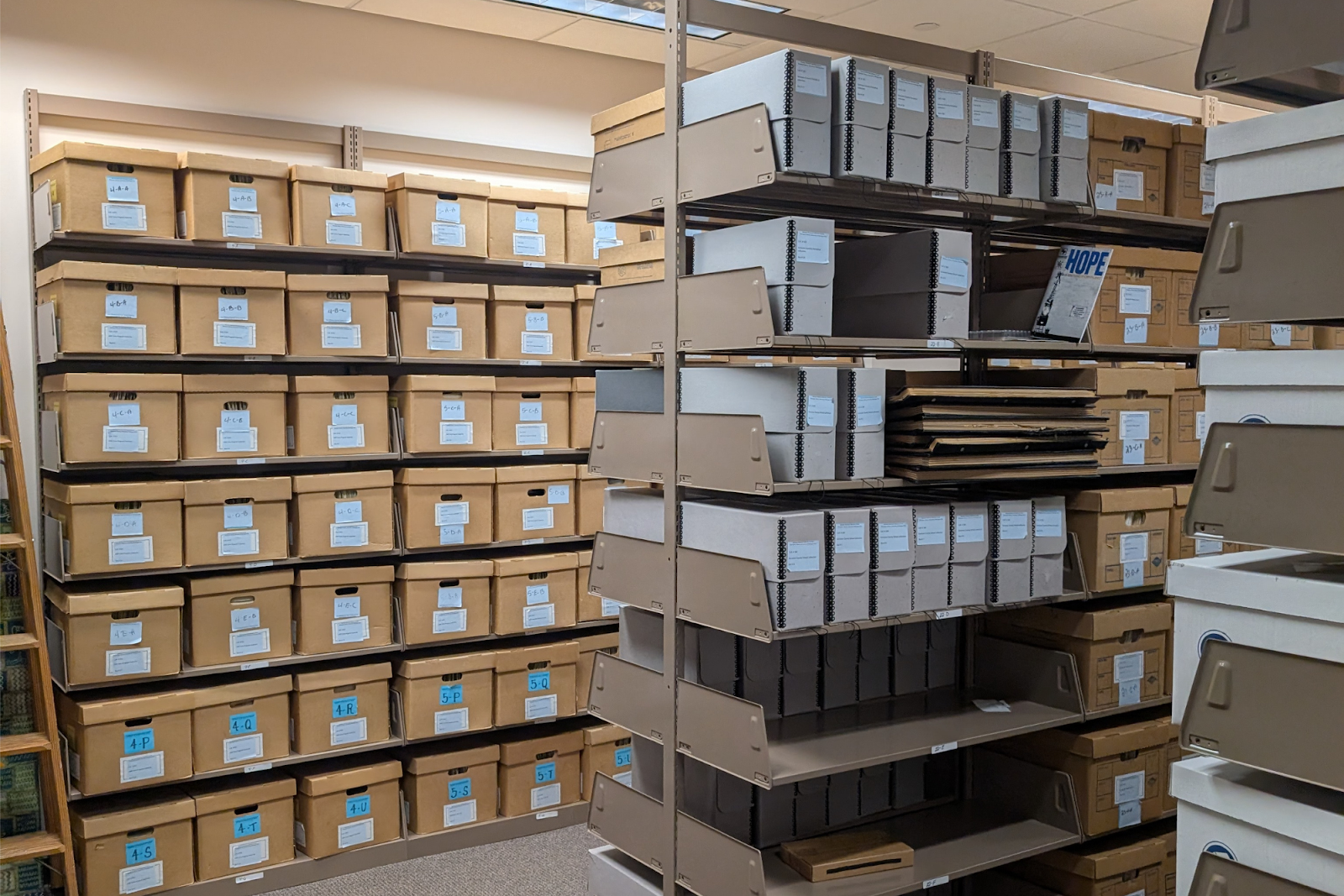 Boxes line the shelves at the GHCC inside UM-Flint's library.