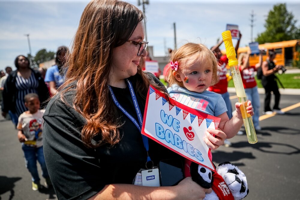 Mom and baby at the Rx Kids Baby Parade 2024.