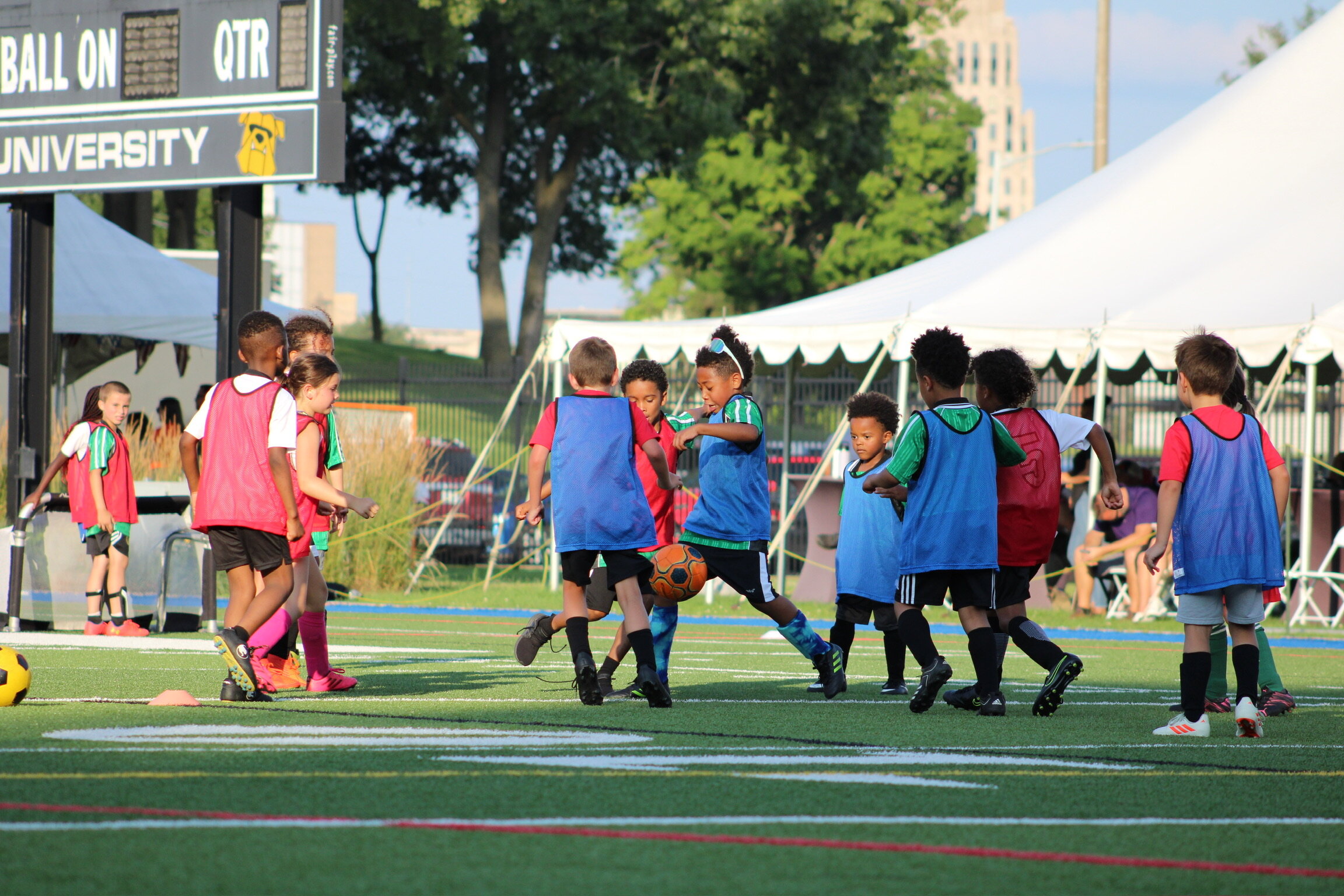 The kids of Flint Style Soccer practice on the field. (Photo credit: Susan Lanstra)