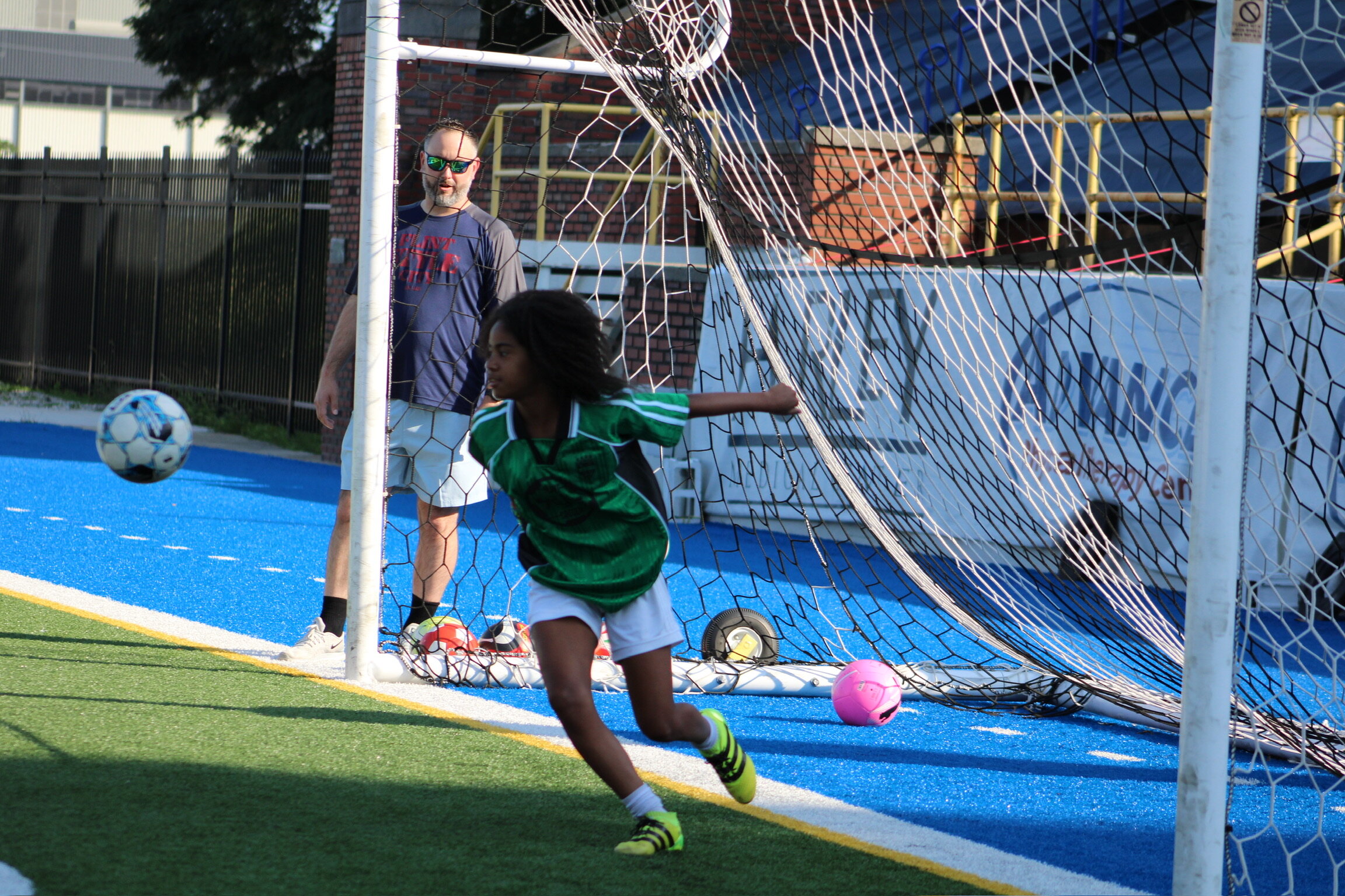 A young Flint Style Soccer player on the field. (Photo credit: Susan Lanstra)