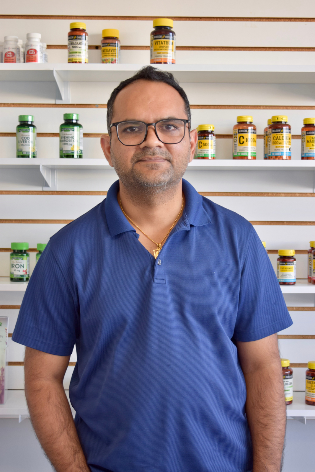 Pharmacist Nirav Gandhi at Maxwell Pharmacy wants to let Flint residents know they are accepting new patients. (Michell Thompson | Flintside.com)