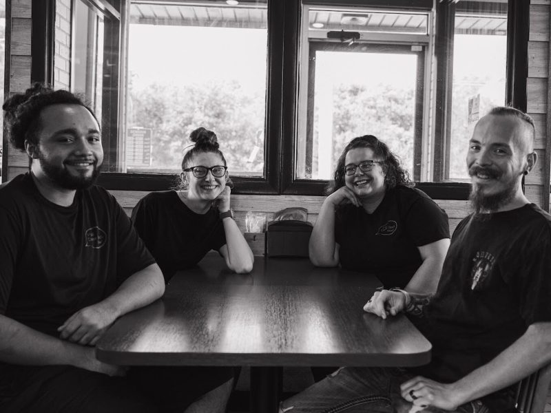 Pictured with staff members, co-owner Ron Housley of Maude's Alabama BBQ (far right) discusses the beauty of resilience, the power of family, and providing Southern hospitality on the east side of Flint.
