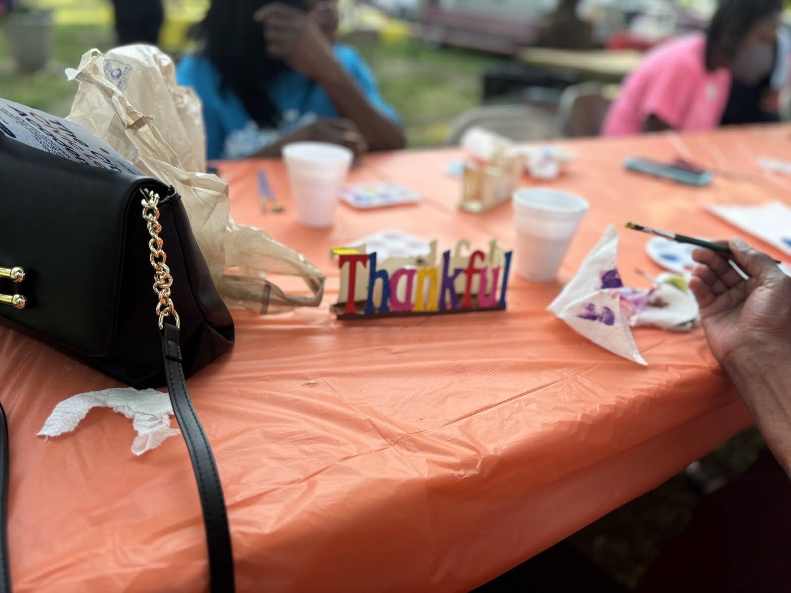 Participants enjoy painting and other festivities at the Brownell-Holmes Neighborhood Association event on Sept. 12, 2024. (Jerimiah Whitehead | Flintside.com)