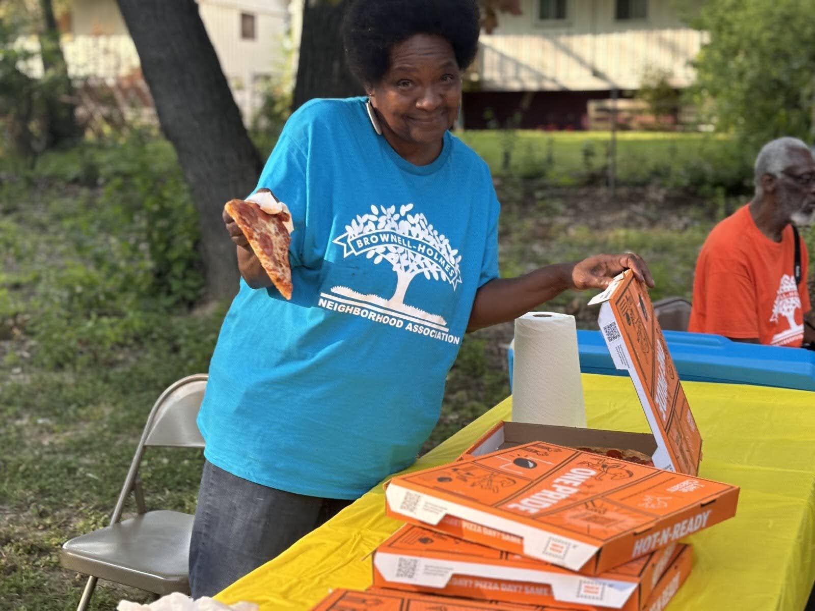 Jeanette Edwards is all smiles, serving food and enjoying a good time amongst Brownell-Holmes community members on Sept. 12, 2024. (Jerimiah Whitehead | Flintside.com)