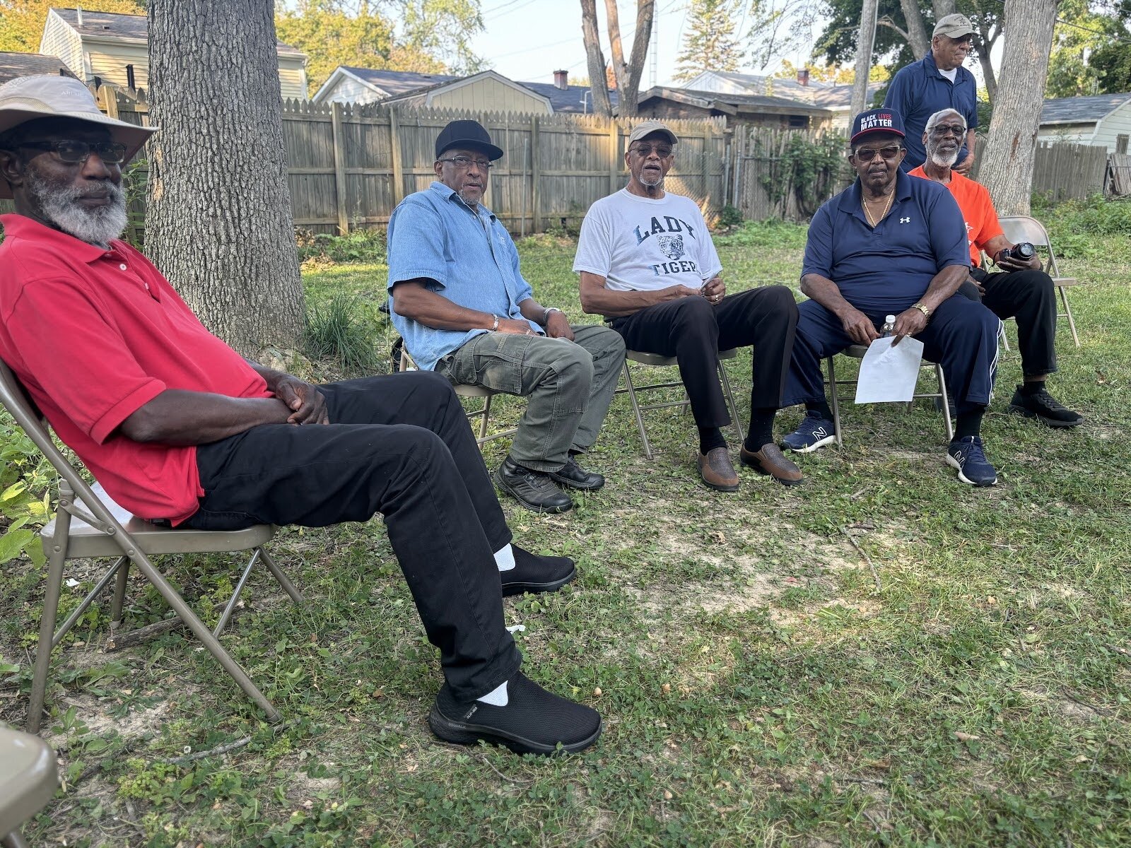 The members of the board are gathered, savoring a serene day in the vibrant Brownell/Holmes neighborhood on Sept. 12, 2024. (Jerimiah Whitehead | Flintside.com)
