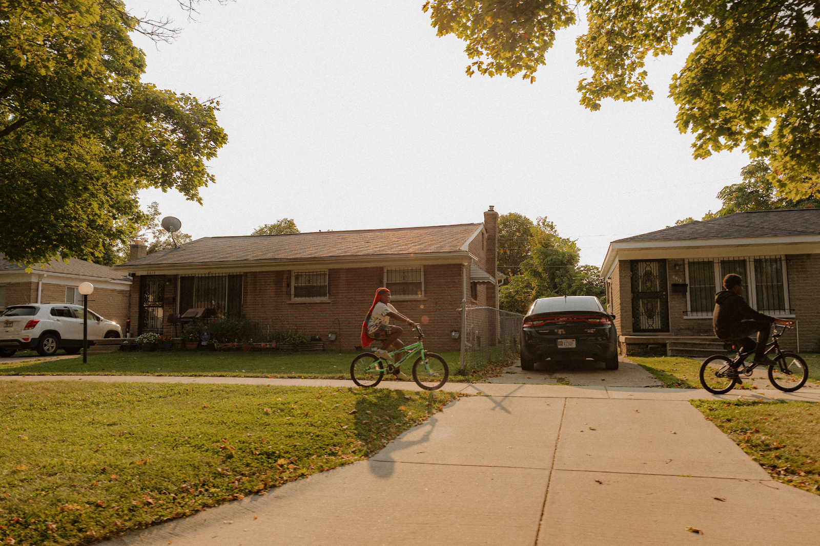 Two boys ride home during sunset on Sept. 15, 2024. (Anthony Summers | Flintside.com)