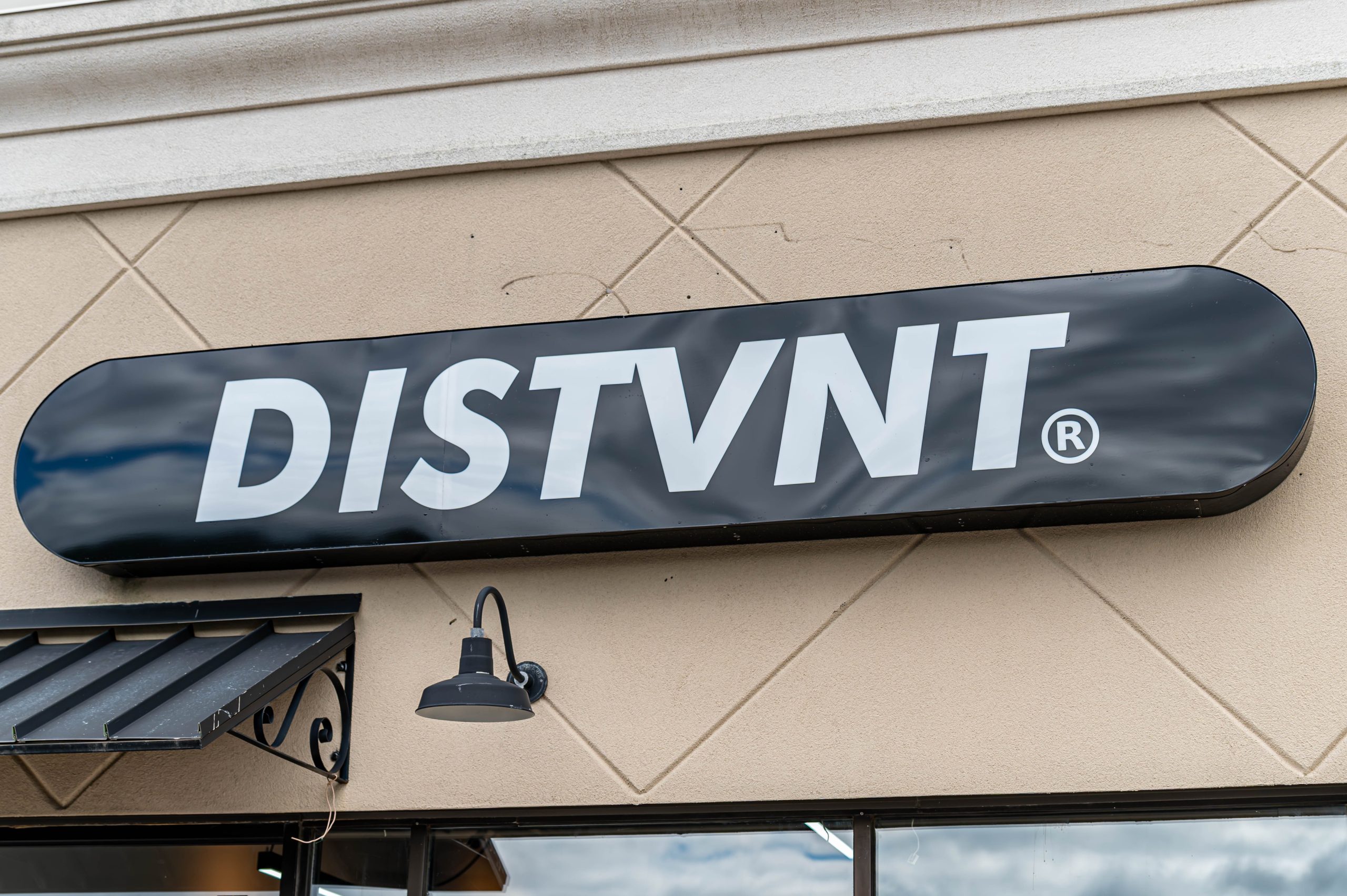 The sign of DISTVNT's new storefront, located at 4205 Miller Rd Suite c16 in Flint Township. (Ray Gray | Flintside.com)