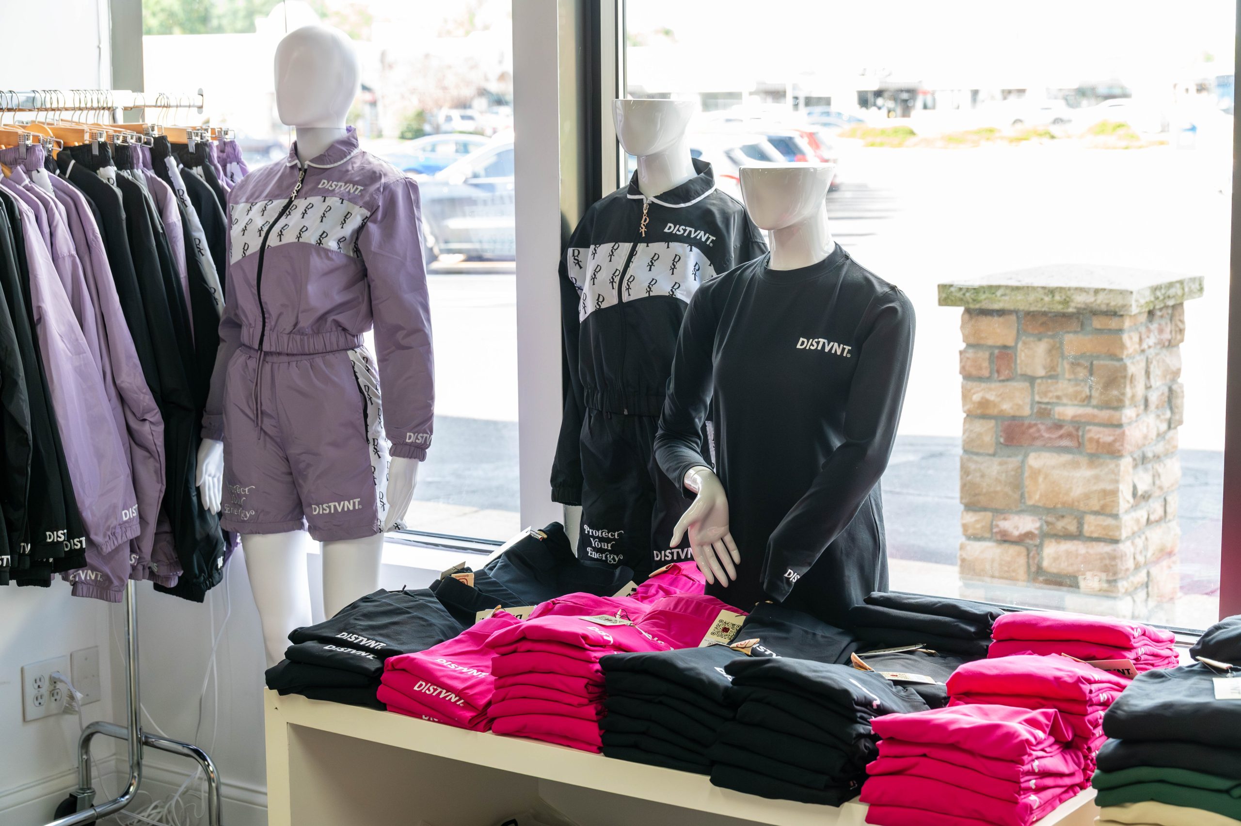 A table displays DISTVNT-brand clothing during the grand opening of DISTVNT's storefront on Saturday, September 7, 2024. (Ray Gray | Flintside.com)