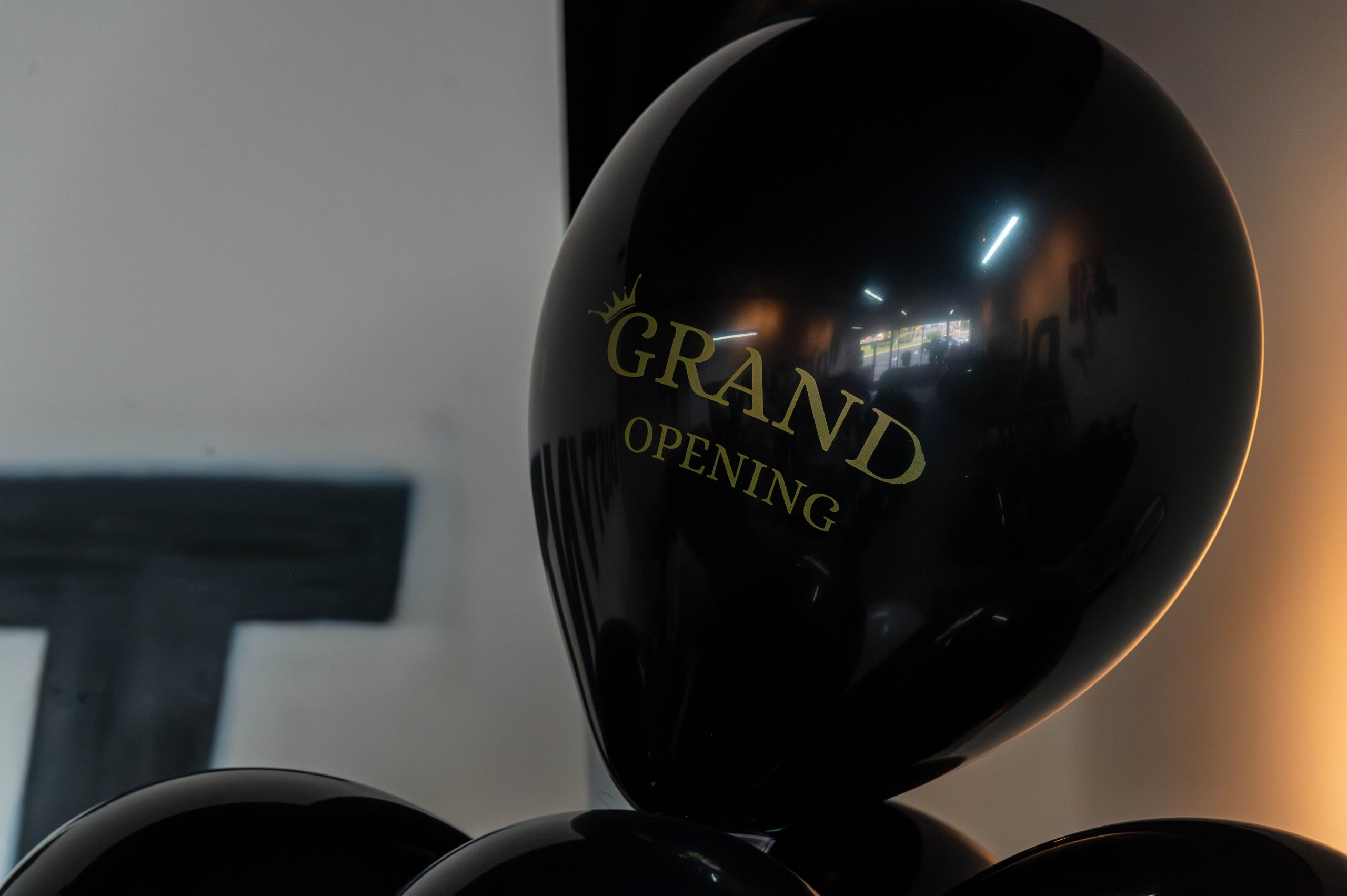 Swanky balloons that read 'grand opening' were part of the celebration of DISTVNT's new storefront on Saturday, September 7, 2024. (Ray Gray | Flintside.com)