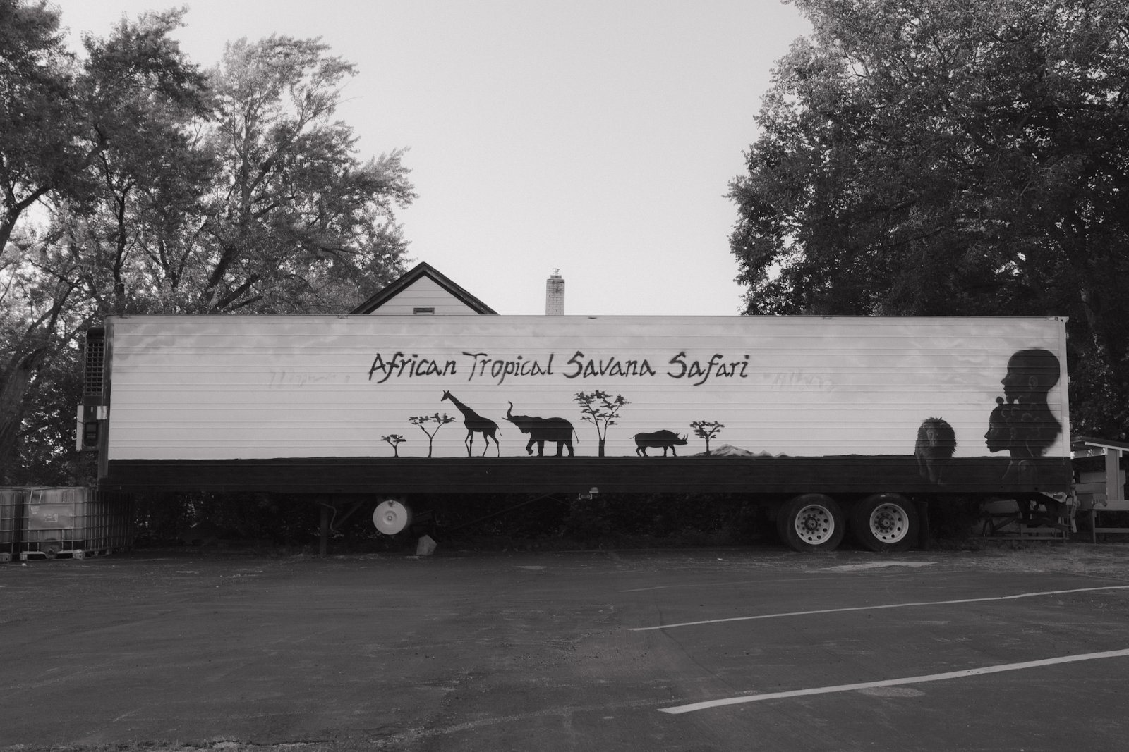 Pictured on Aug. 12, 2024, a trailer for the African Tropical Savana Safari is outside the Urban Renaissance Center. (Anthony Summers | Flintside.com)