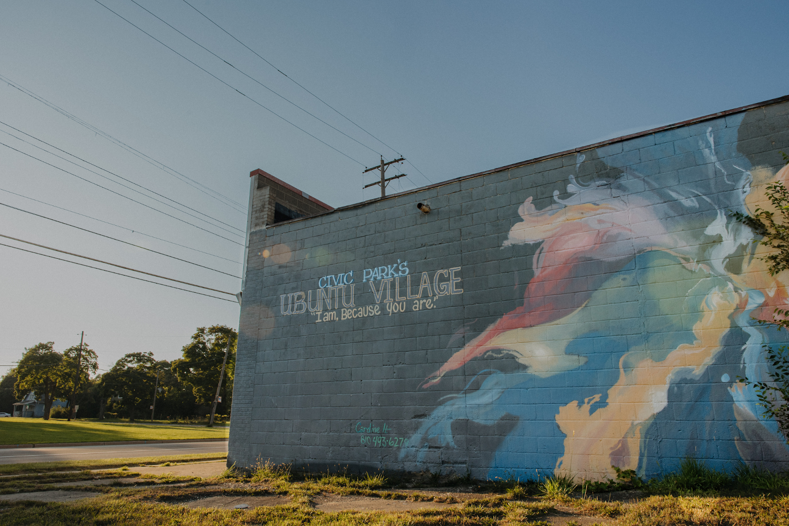Pictured on Aug. 12, 2024, painted on the side of a building, Civic Park calls itself an Ubuntu Village with the saying "I am, because you are." (Anthony Summers | Flintside.com)