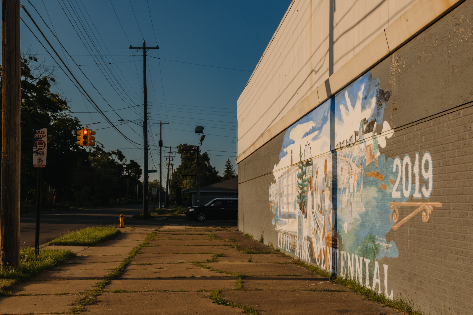 Pictured on Aug. 12, 2024, a large mural celebrates Civic Park's 2019 centennial year. (Anthony Summers | Flintside.com)
