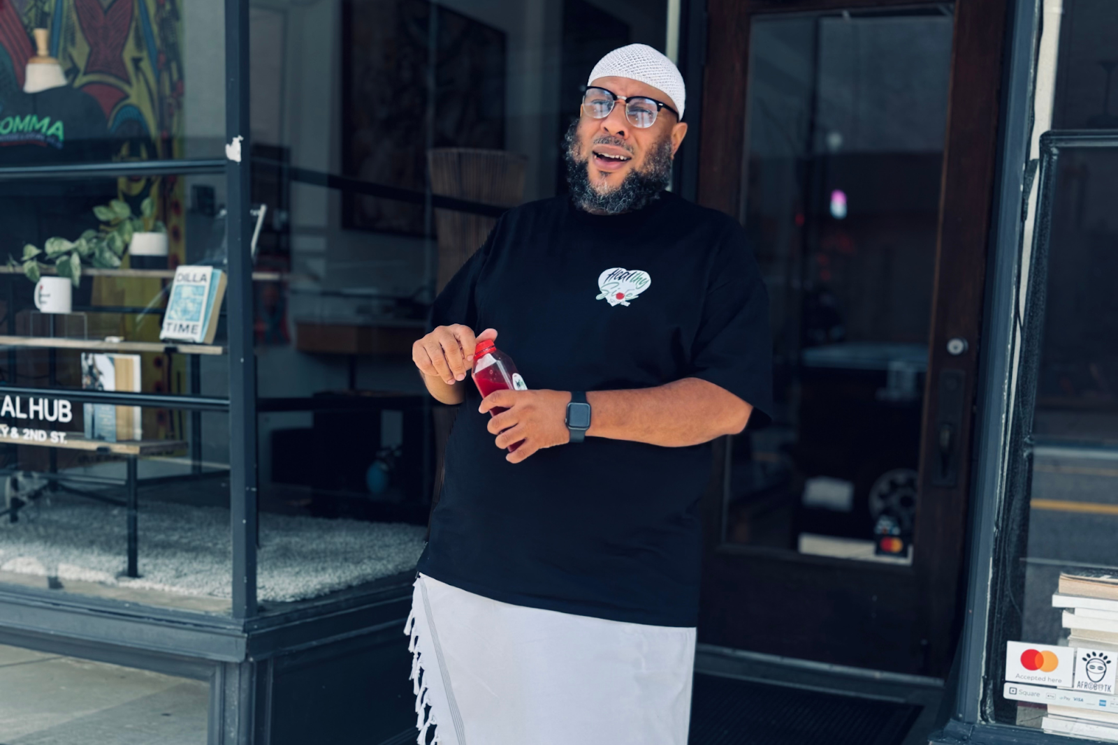 Sa’eed Littlejohn outside of Comma Bookstore in downtown Flint. (Jerimiah Whitehead | Flintside.com)