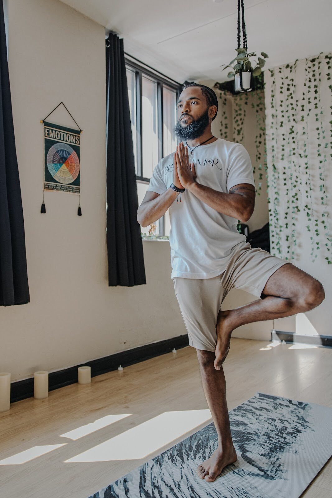 Pictured in the tree pose on July 13, 2024, Terance Green's mission is to promote self-care and love for oneself. (Anthony Summers | Flintside.com)