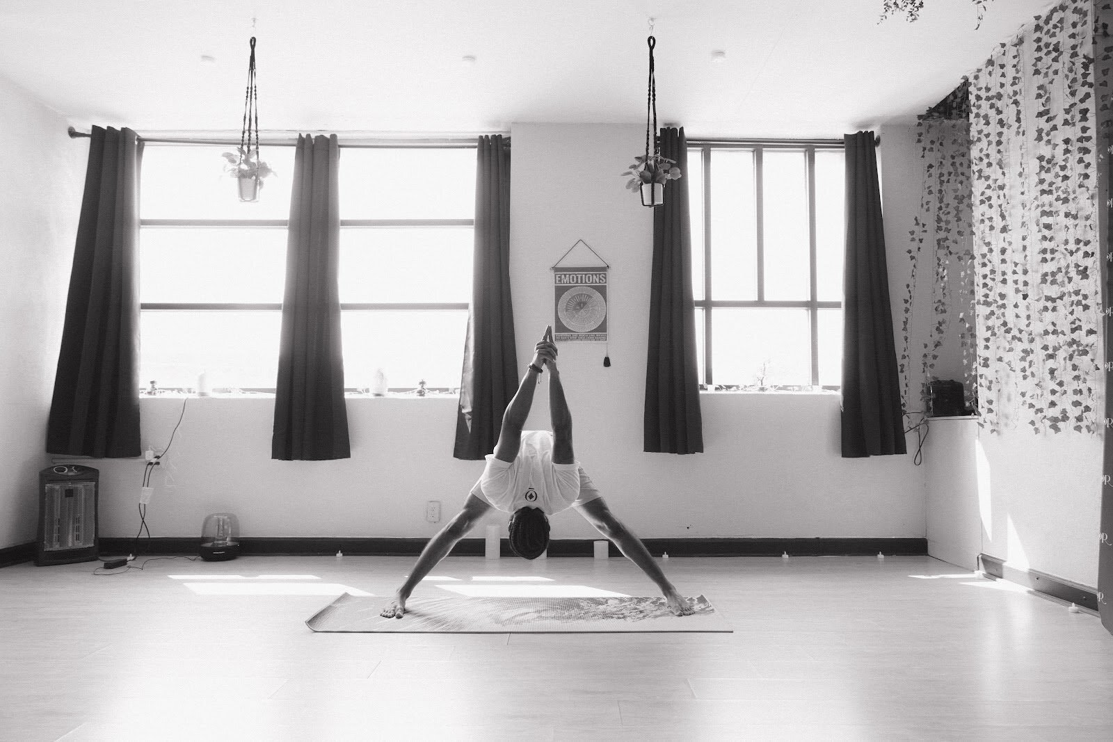 “You have to set the tone for your life, you have to change it, and expect nobody else to be there for you,” cites Green in a yoga pose inside Black Amor studio on July 13, 2024. (Anthony Summers | Flintside.com)