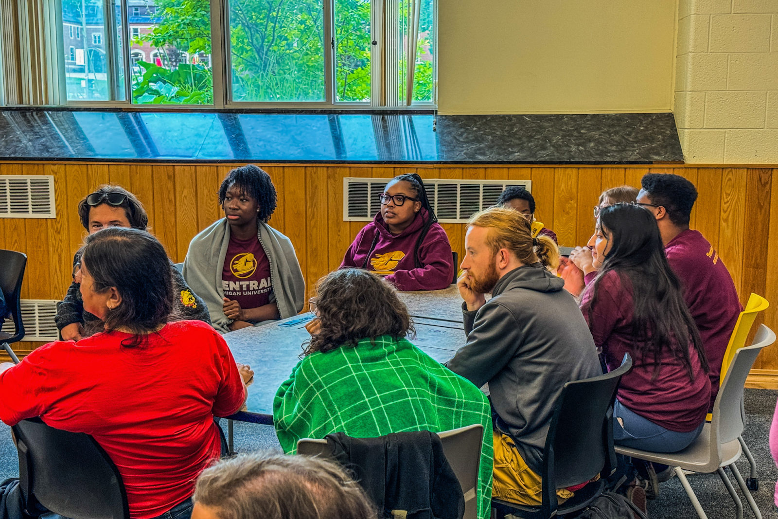 CMU and FSU college mentor staff listening to MTU's Unboxed Challenge on June 26, 2024. (Xzavier Simon | Flintside.com)