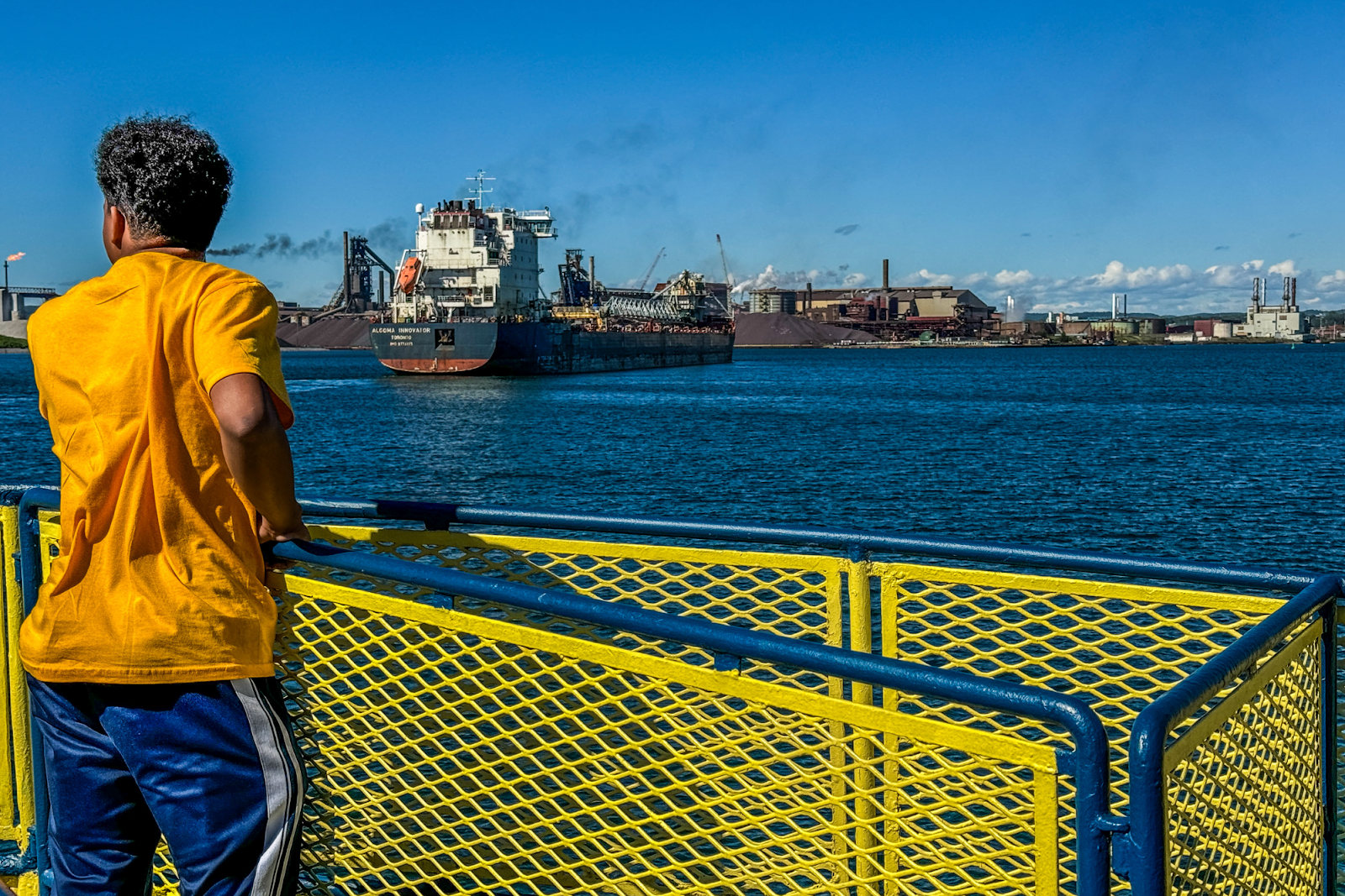 A GEAR UP student taking in the sights on the Soo Locks Boat Tour in Sault Ste Marie, MI, near Lake Superior State University on June 27, 2024. (Xzavier Simon | Flintside.com)