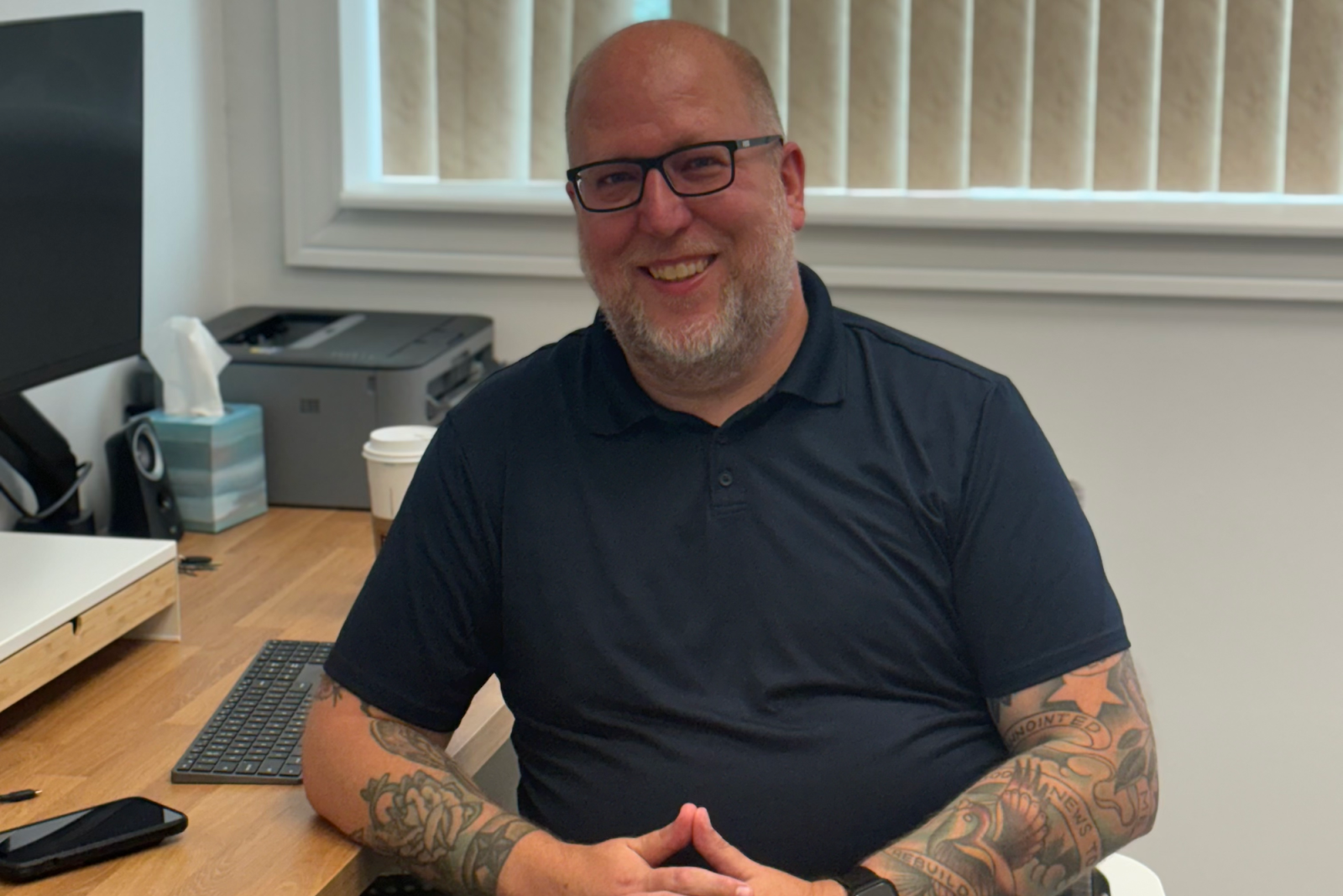 Tom Wyatt, Executive Director of the Neighborhood Engagement Hub, is all smiles as he explains how the NEH operates in the greater Flint Community. (Jerimiah Whitehead | Flintside.com)