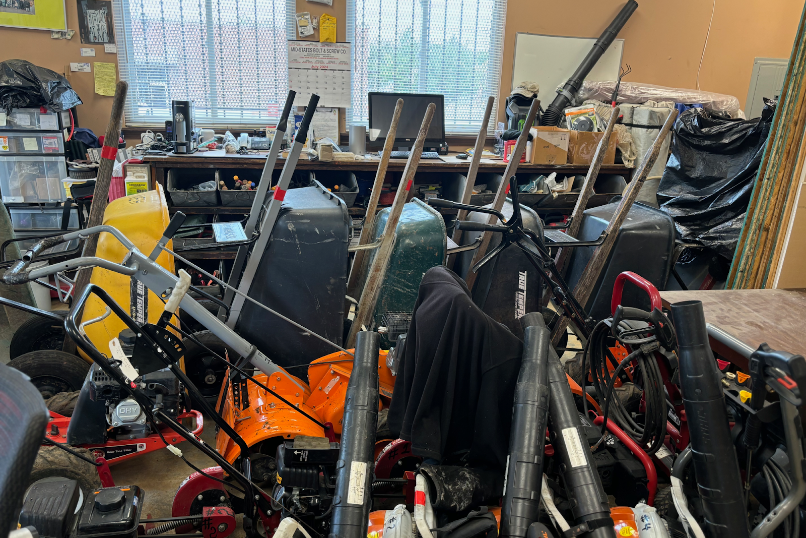 The NEH's Community Tool Shed houses lawnmowers, snowblowers, barrels, gas cans, and more that Flint residents can check out for free. (Jerimiah Whitehead | Flintside.com)