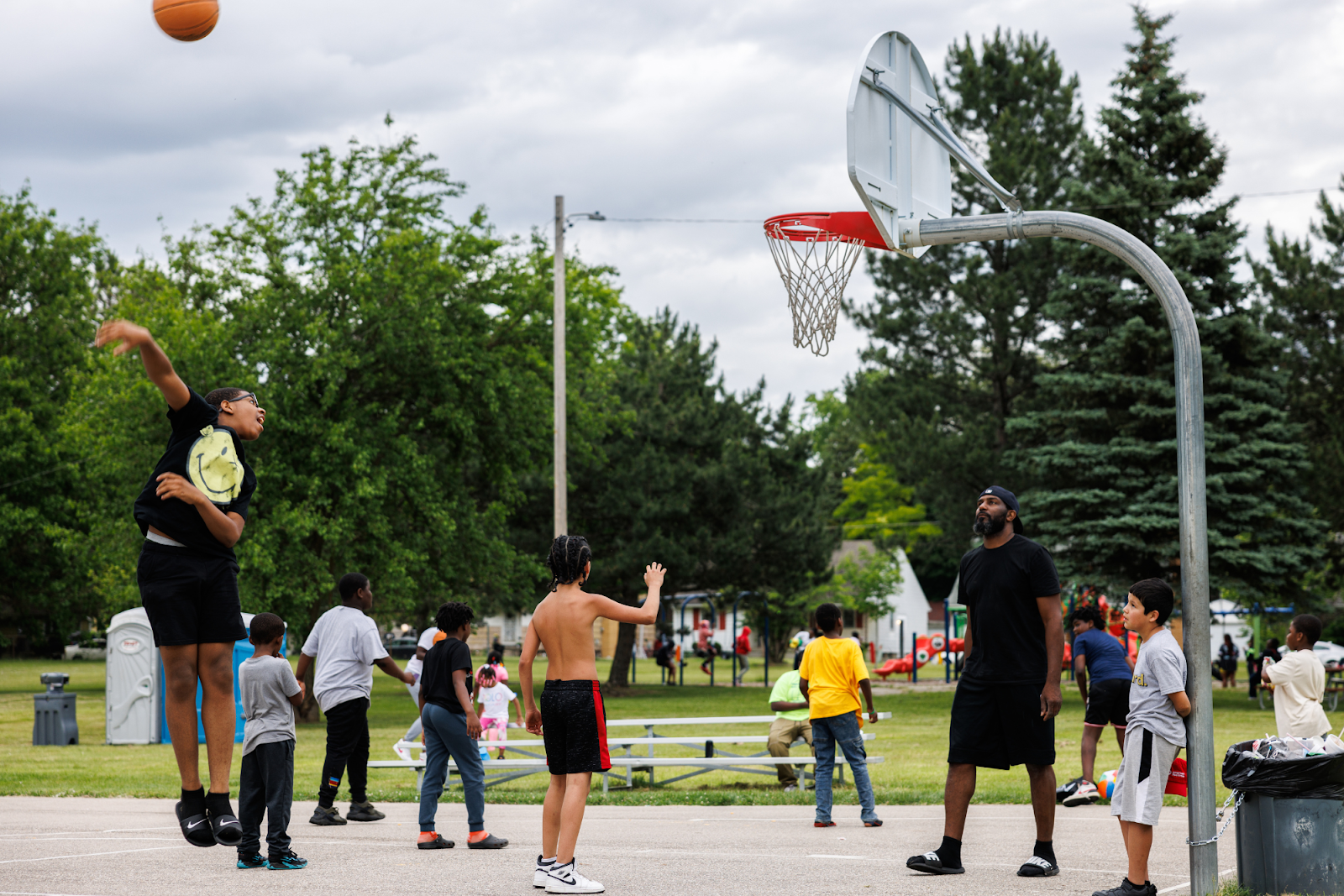 An exuberating basketball match at Sarvis Park's Juneteenth kickoff celebration on June 8, 2024.