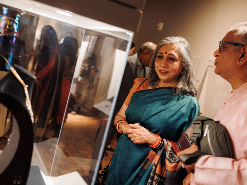 Onlookers marvel at the handcrafted jewelry on display in the 'Meditations in Gold: South Asian Jewelry' exhibit on May 16, 2024.