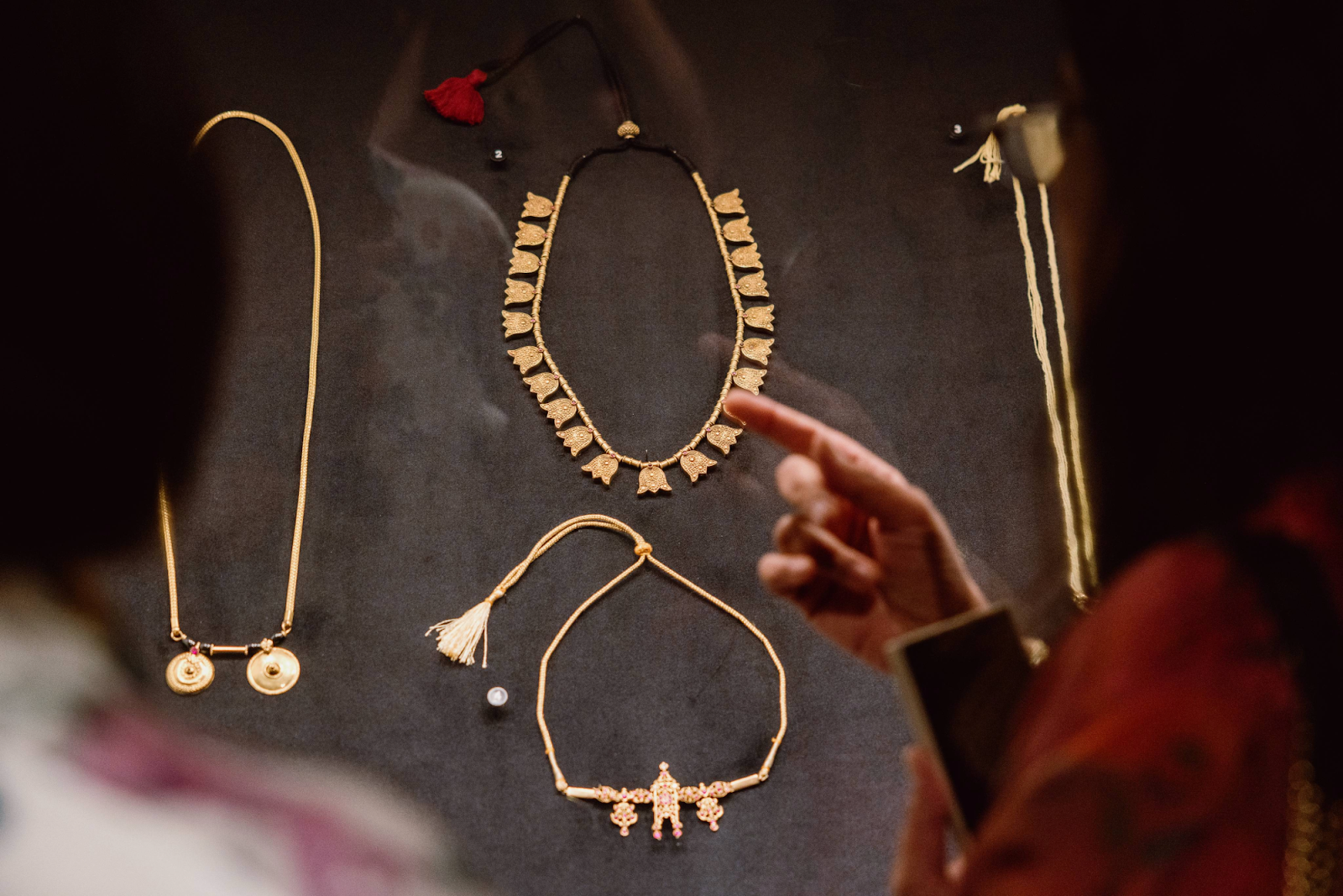 "The exhibition is a celebration of jewels that have survived the melting pot,” explains Dr. Usha Balakrishnan in the 'Meditations in Gold: South Asian Jewelry' exhibit on May 16, 2024. (Bryce Mata | Flintside.com)