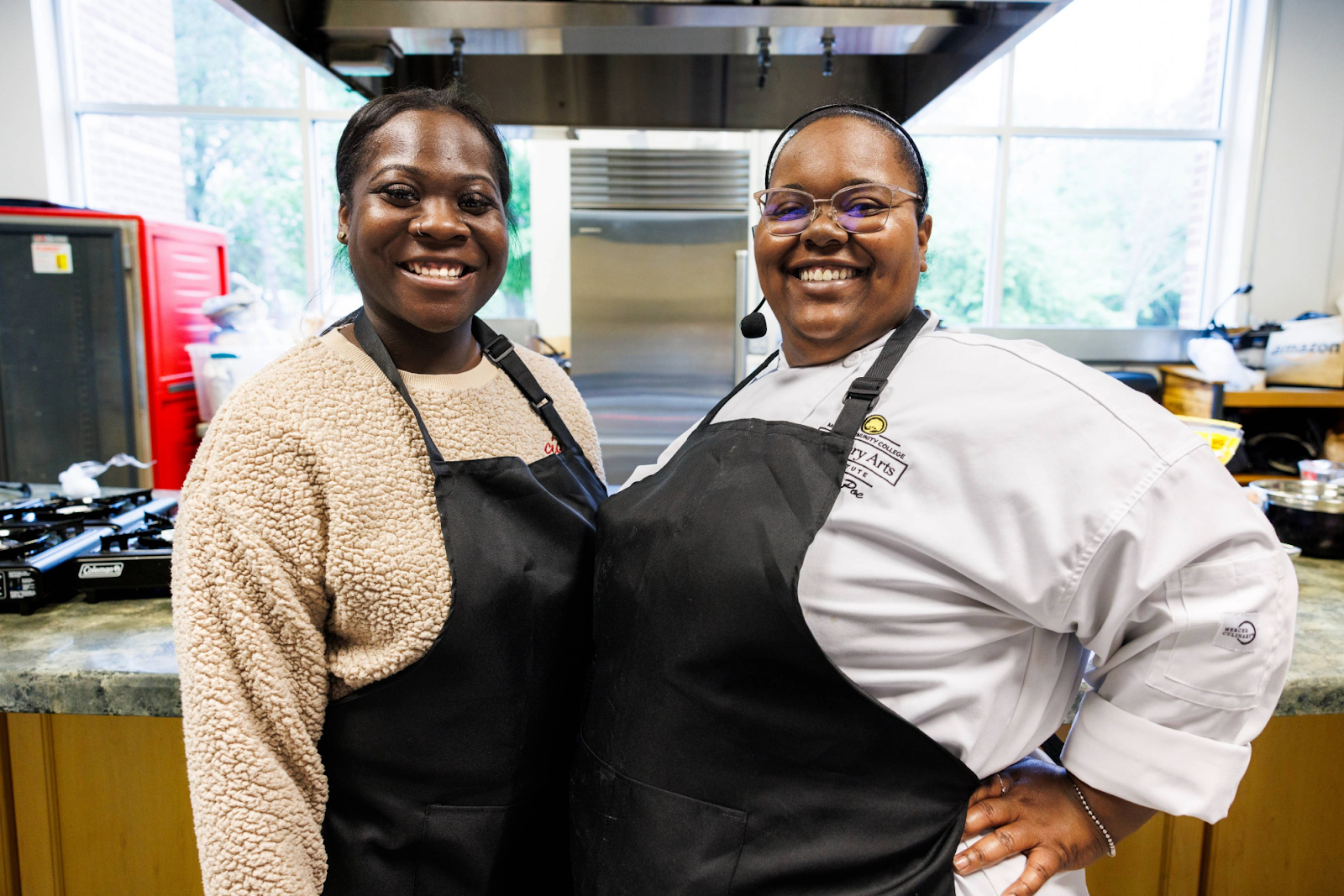 Program Manager Cheree Riddle and Chef Tee are all smiles after another successful NourisHER class at the Flint Farmers' Market on May 11, 2024. (Bryce Mata | Flintside.com)