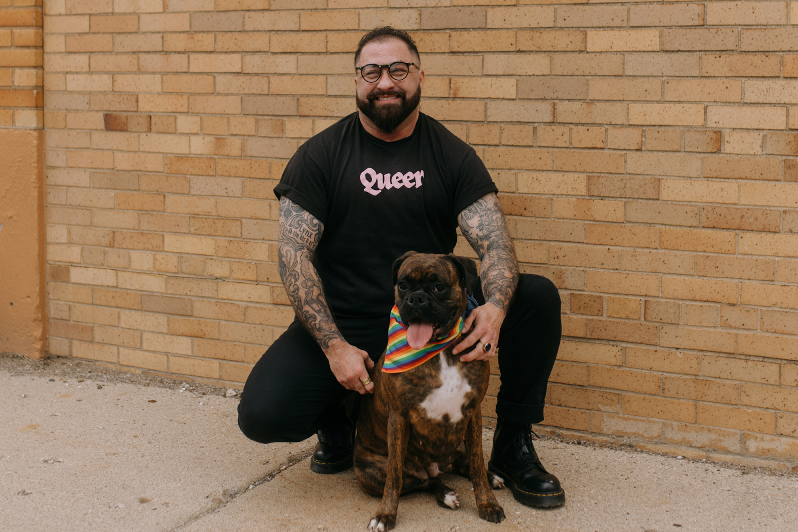 Flint native and queer activist Mason Gallo and their dog, Olive, pictured out and around Flint on May 4, 2024. 
