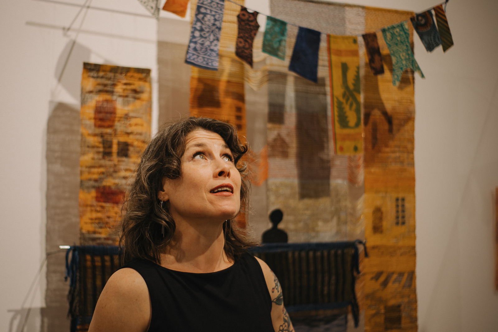 "One of my big goals was to find ways to embrace the non-visual artists, welcome them back in, and get involved," explains Michele Leclaire inside Buckham Gallery on April 18, 2024. (Anthony Summers | Flintside.com)