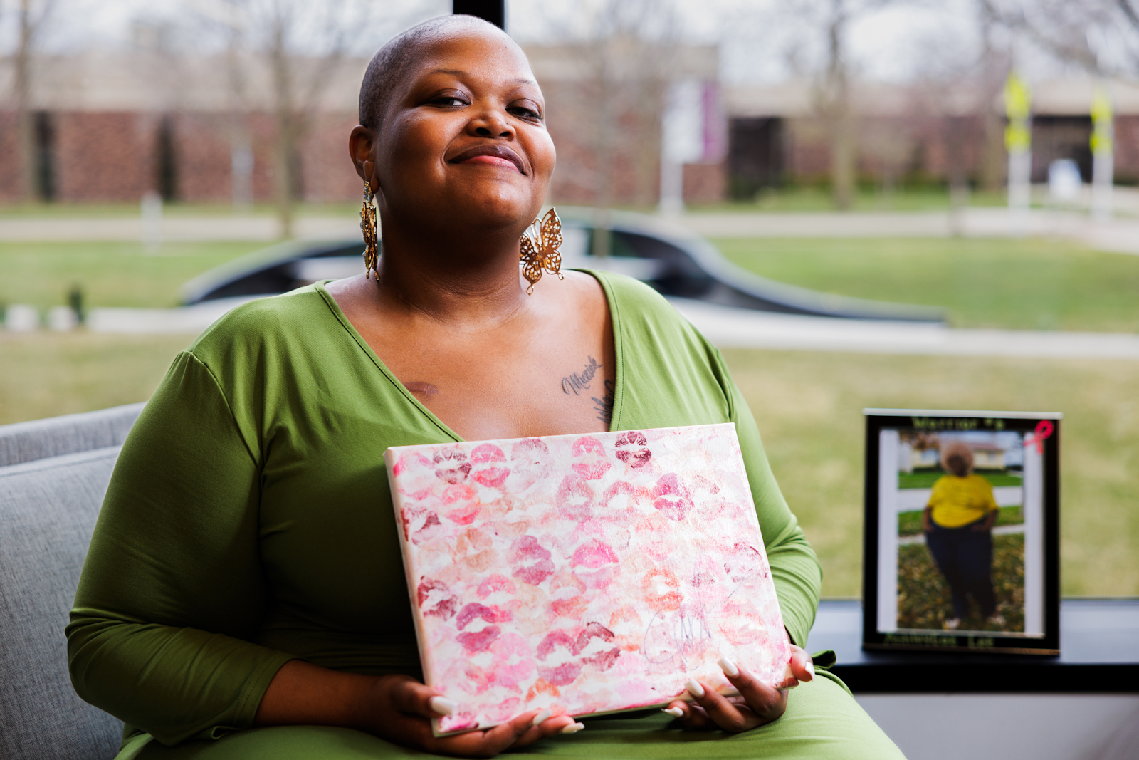 AshleyCar Lee is all smiles at the Flint Public Library on March 26, 2024, as a "mountain mover," understanding that "when my times does come, that means that my mission was done." (Bryce Mata | Flintside.com)