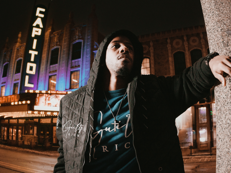 Award-winning actor and content creator Brandon Houston poses in front of the Capitol Theatre in downtown Flint on Jan. 30, 2024.