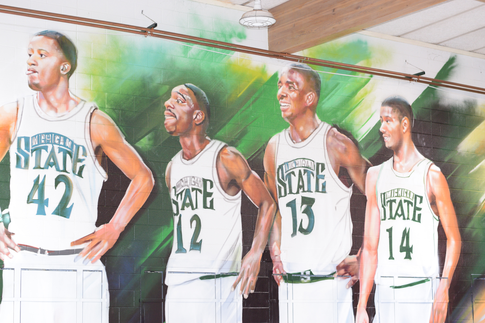 A mural of 'The Flintstones' is displayed inside the renovated gym at St. Mark on Jan. 6, 2024. (Michell Thompson l Flintside.com)