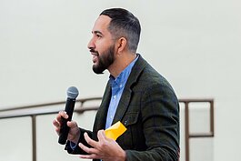 Salvador Lopez, president, KConnect, presents at the event. 
