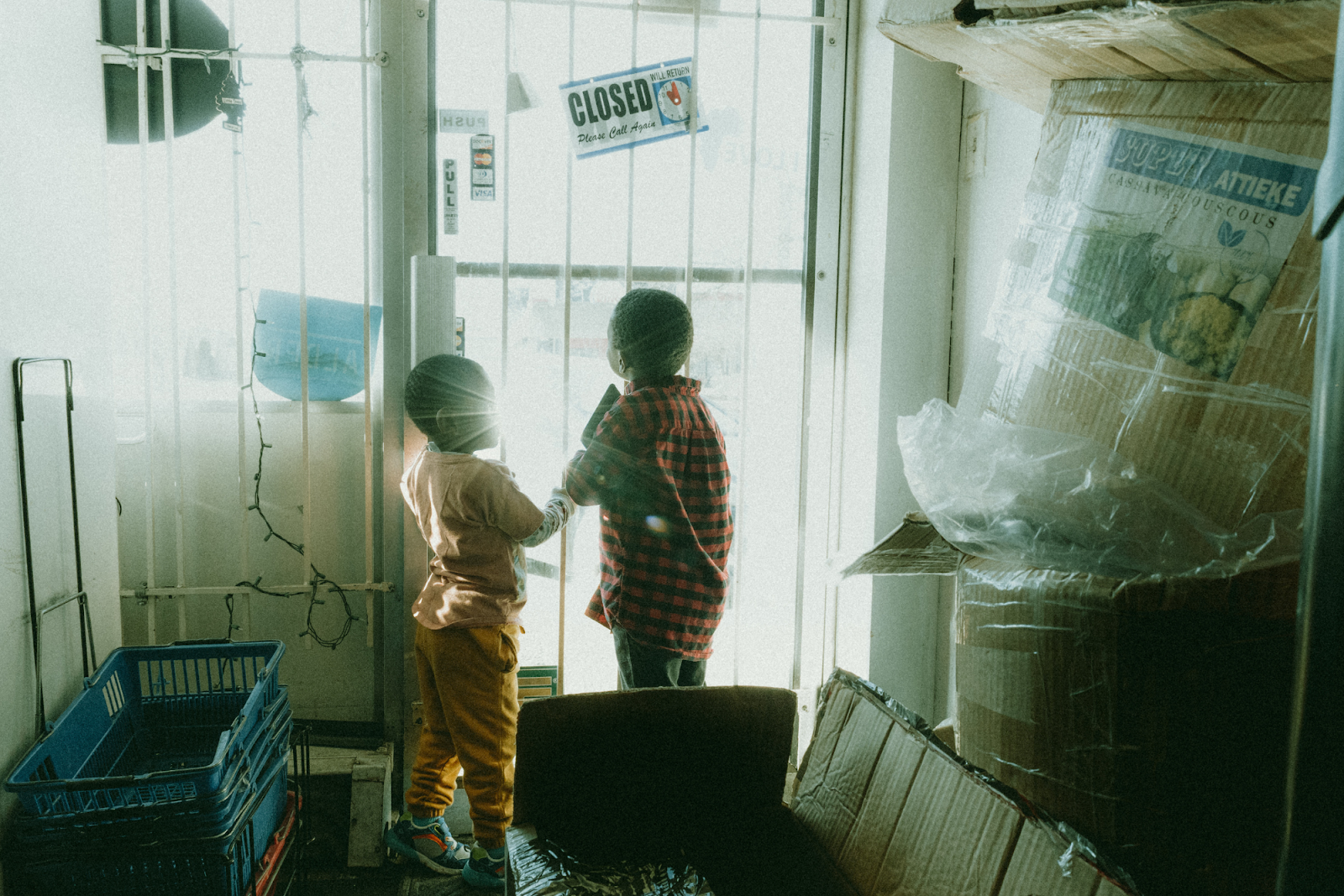 Two young boys play around inside BAMS on Dec. 20, 2023. (Anthony Summers | Flintside.com)