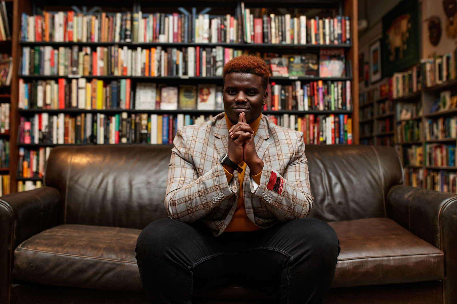 Pictured inside Totem Books on Nov. 17, 2023, author and poet Jerimiah Whitehead brings an empathic writing to leave readers with the question, "If not you, then who? If not now, then when?" (Jenifer Veloso | Flintside.com)