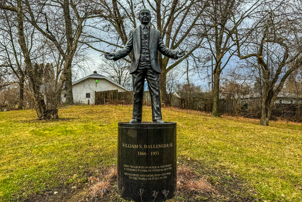 Pictured on Dec. 27, 2023, a statue of William S. Ballenger sits as a beacon to commemorate the life of one of the founding members of Buick Motor Car Company. (Xzavier Simon | Flintside.com)