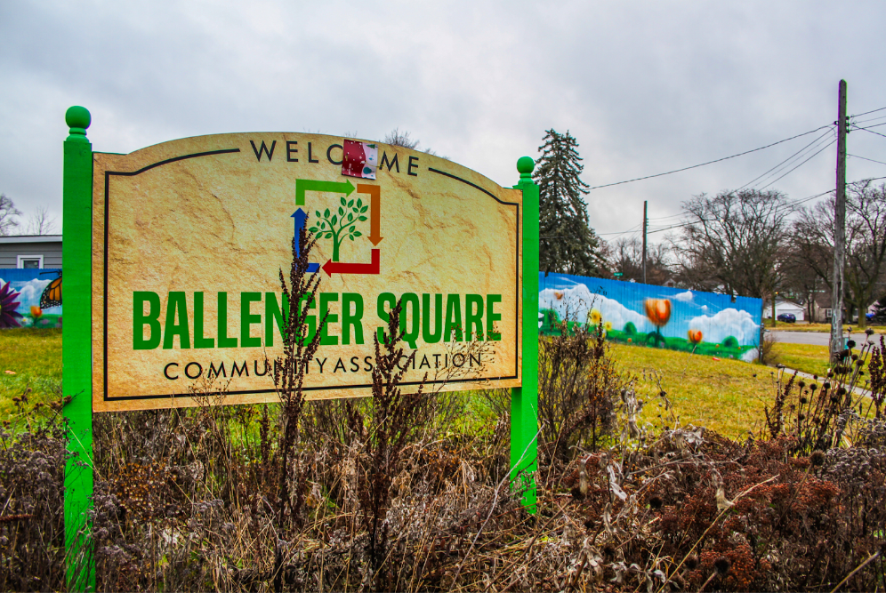 Pictured on Dec. 27, 2023, a colorful sign welcomes community members and residents to the Ballenger Square Community Association. (Xzavier Simon | Flintside.com)
