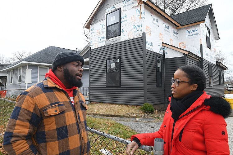Community advocate James Gunter and Ashley Hines, executive director, Benton Harbor Community Development Corporation, in front of a future neighborhood hub on Broadway Avenue in Benton Harbor.