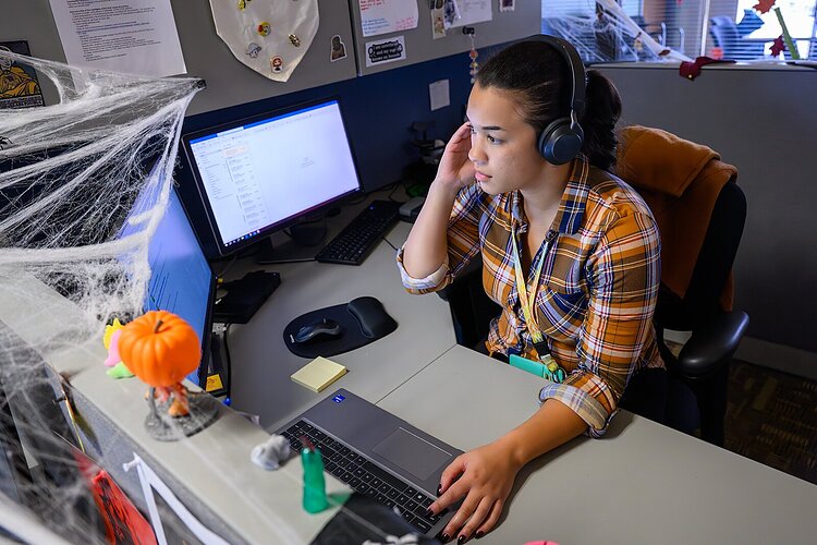 The #wishyouknew campaign creates a safe space where youth and adults can talk. Rachael Roston, WCCMH Crisis Team, fields a call.