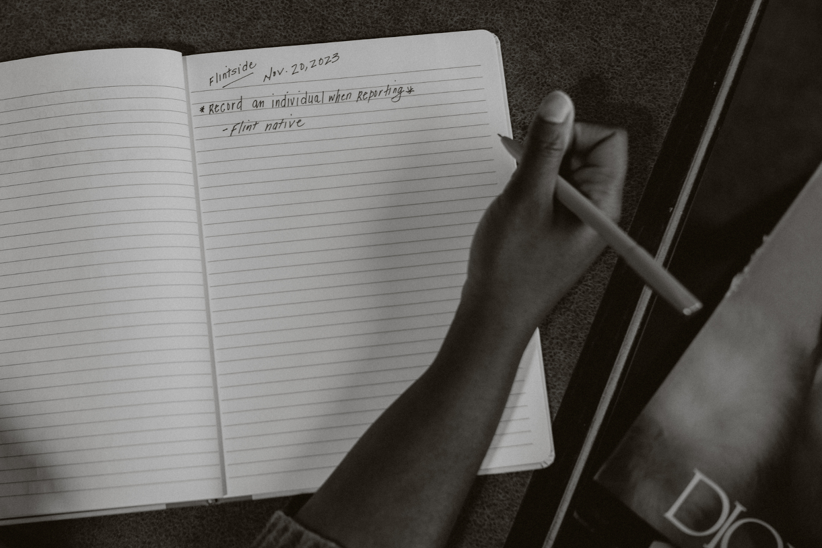 Dantzler carries her notepad everywhere, jotting down notes as she shares why she decided to join Flintside's Community Correspondent Course at Totem Books on November 20, 2023. (Anthony Summers | Flintside.com)