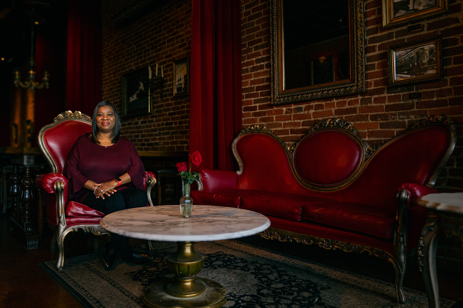 Michell Thompson poses elegantly inside Cafe Rhema in downtown Flint on Nov. 18, 2023. (Anthony Summers | Flintside.com)