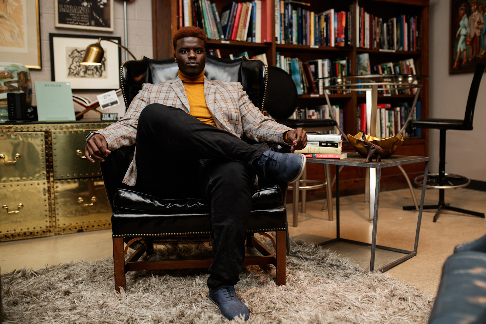 Jerimiah Whitehead gets vulnerable about his experiences growing up in Flint and battling cancer inside Totem Books on Nov. 17, 2023. (Jenifer Veloso | Flintside.com)