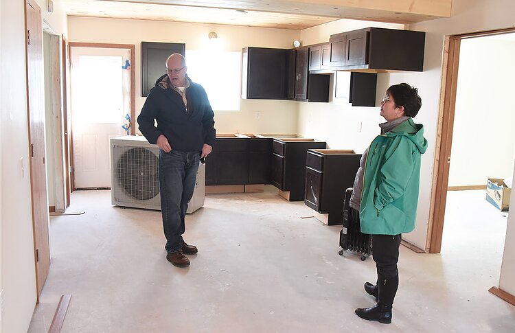 Yarrow Brown and Jon Stimson check out the interior of affordable Vineyard View Apartments in Suttons Bay.