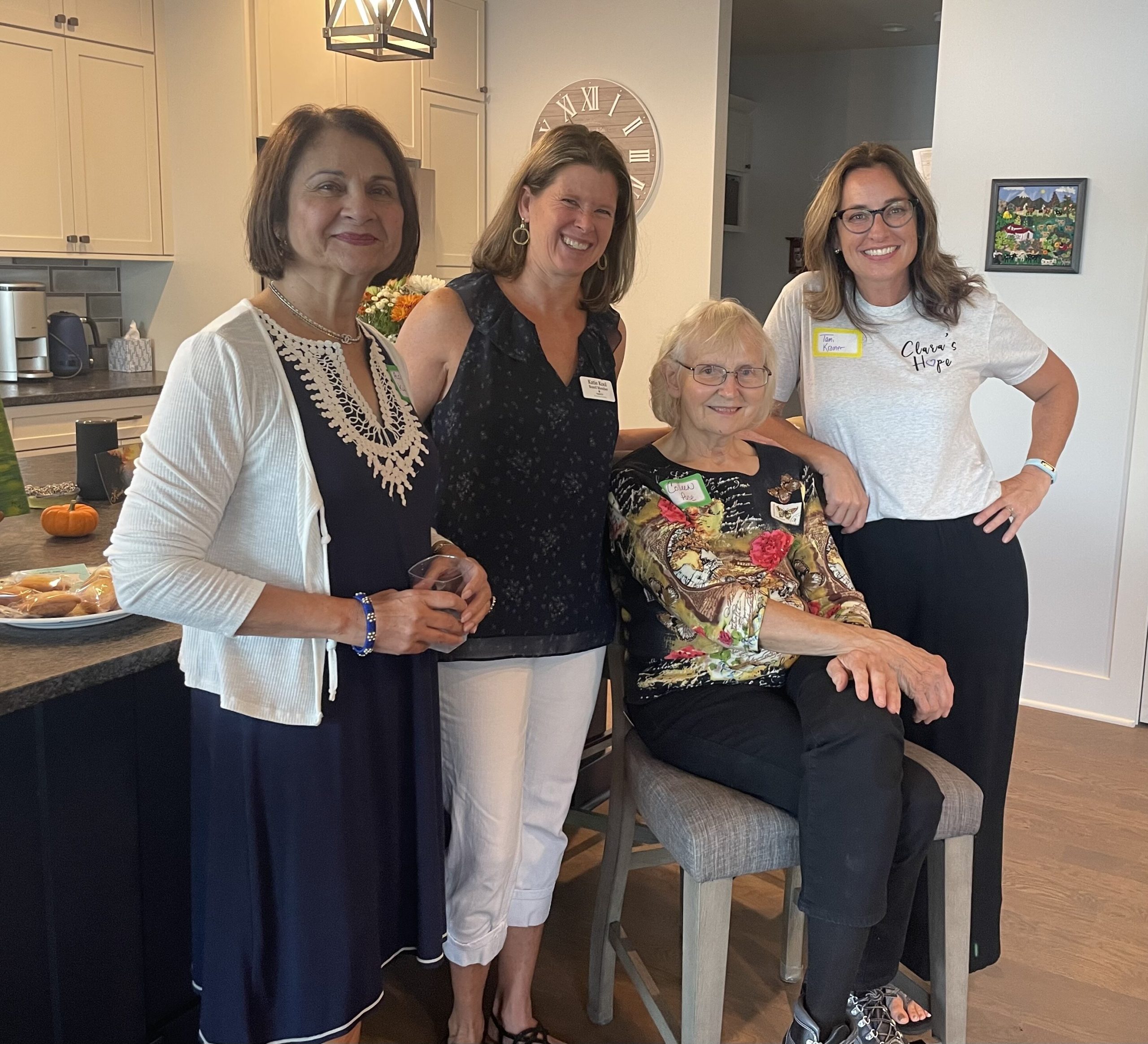 Katie Kool-Wray poses with several members of Impact100 Genesee County. 