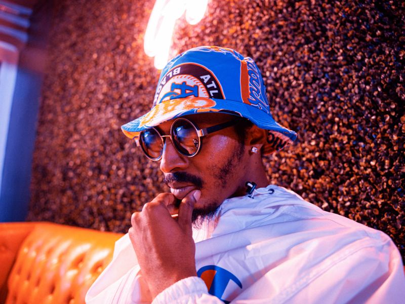 Pictured under neon lights inside Pop Rox in downtown Flint on Oct. 13, 2023, music artist Jernē ponders vulnerability and being authentic in R&B.