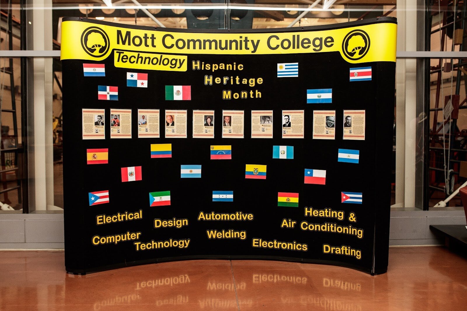 A display honoring Latinx leaders in STEM is displayed during Mott Community College’s Technology Division’s Hispanic Heritage Month Celebration at the Regional Technology Center in Flint on Thursday, Sept. 28, 2023. (Jenifer Veloso | Flintside.com)