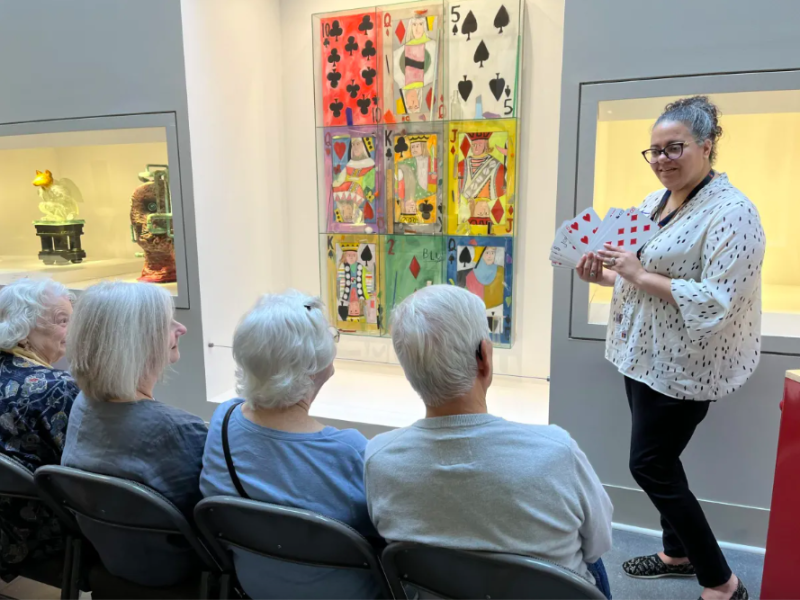 Jennifer Giddings-Essenmacher speaks with participants during a training tour for the Flint Institute of Arts' new Art Spark! program.