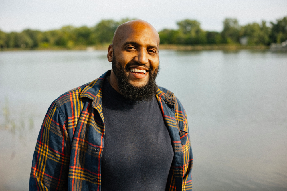 Roland smiles outside his business on September 20, 2023. (Anthony Summers | Flintside)