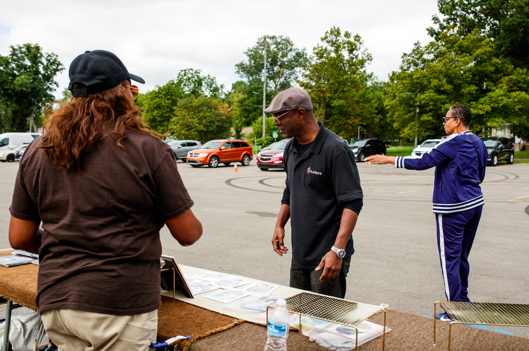 Pastor Hopkins helps team members set up for the ‘Back to School Rally’ at Bethel United Methodist Church in Flint on Saturday, Sept. 9, 2023. (Jenifer Veloso | Flintside.com)